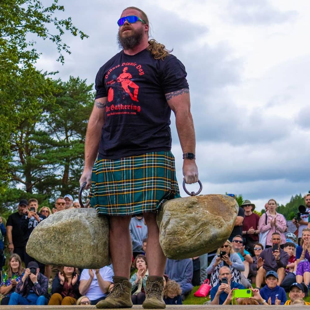 Ben Crook holding Dinnie Stones